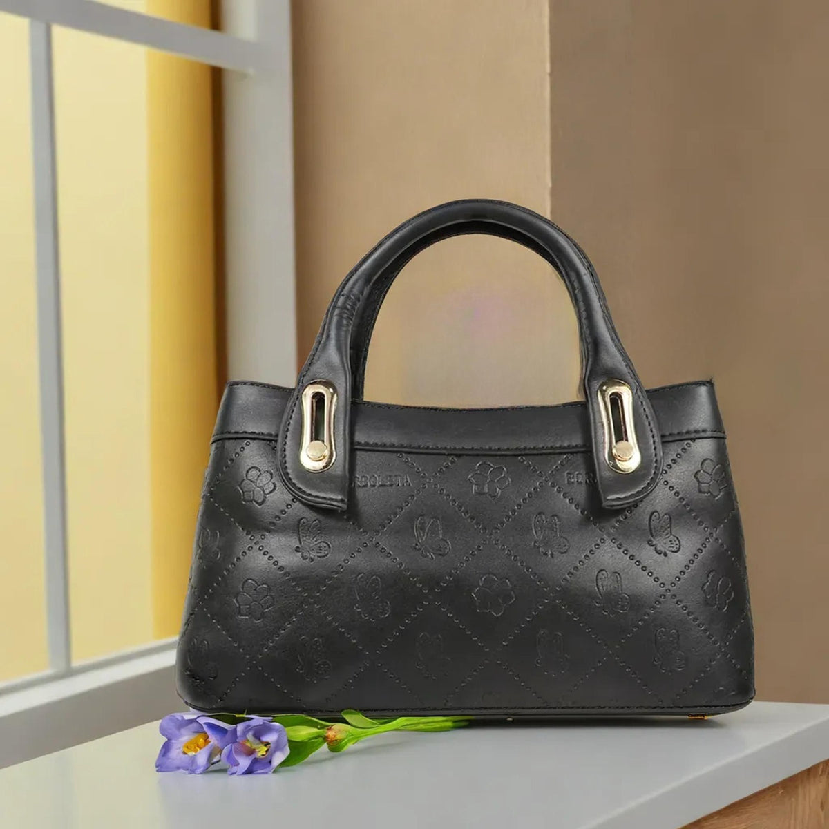 Luxury Handbag with Embossed Design & Gold Accents