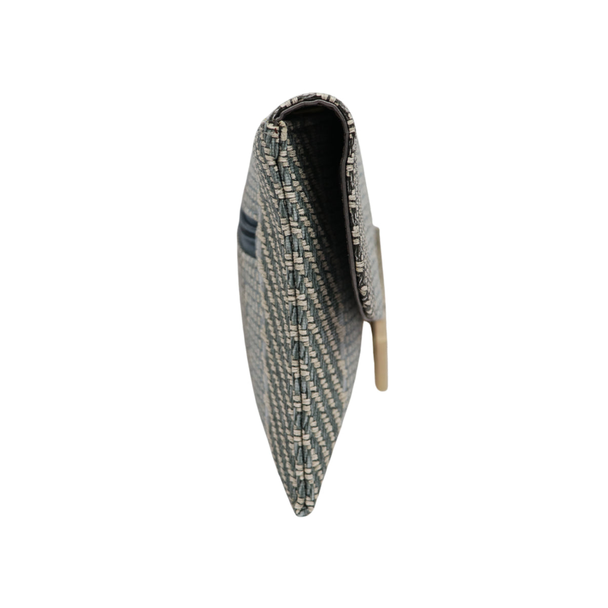 A modern handcrafted clutch with textured weave and bold metal detailing