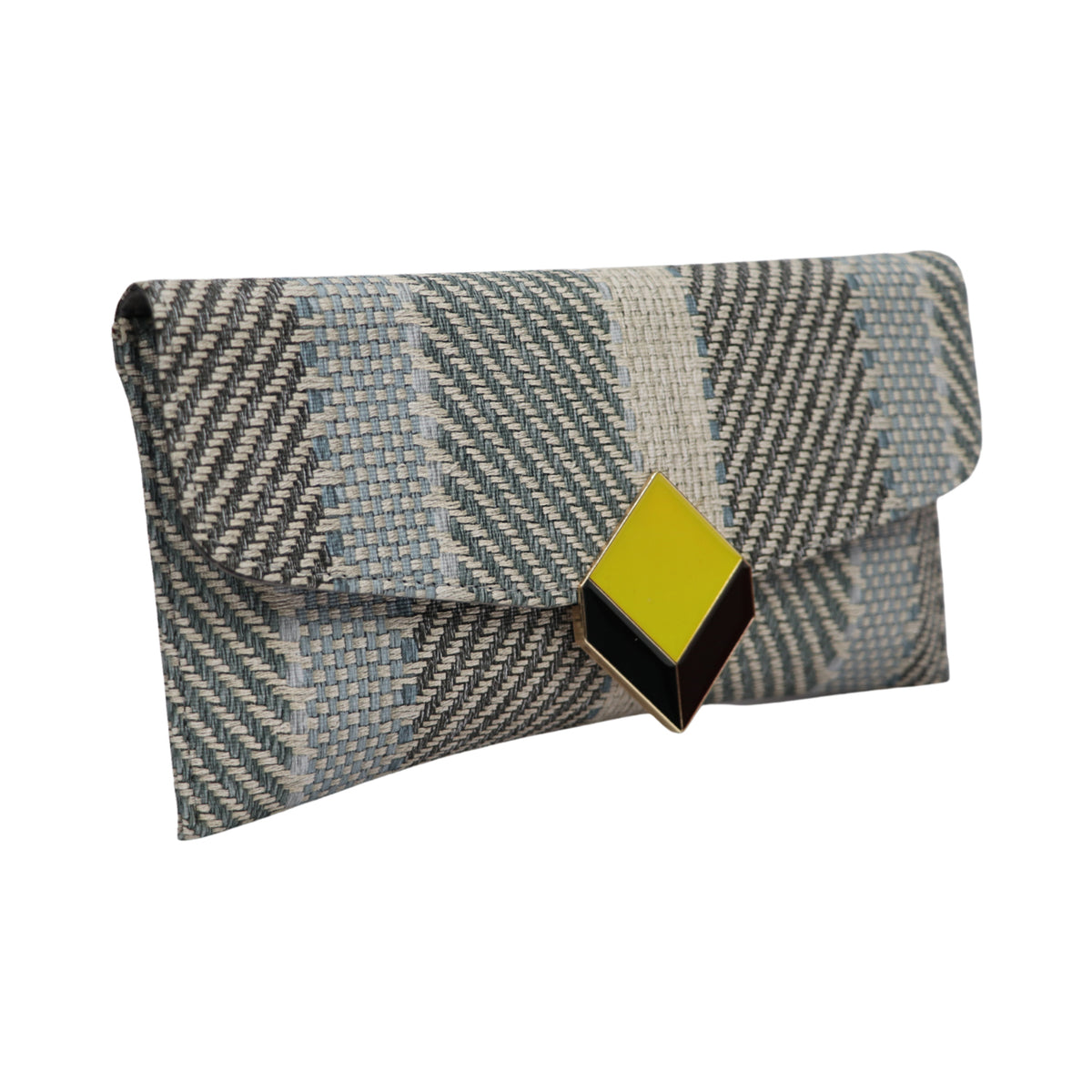 A modern handcrafted clutch with textured weave and bold metal detailing